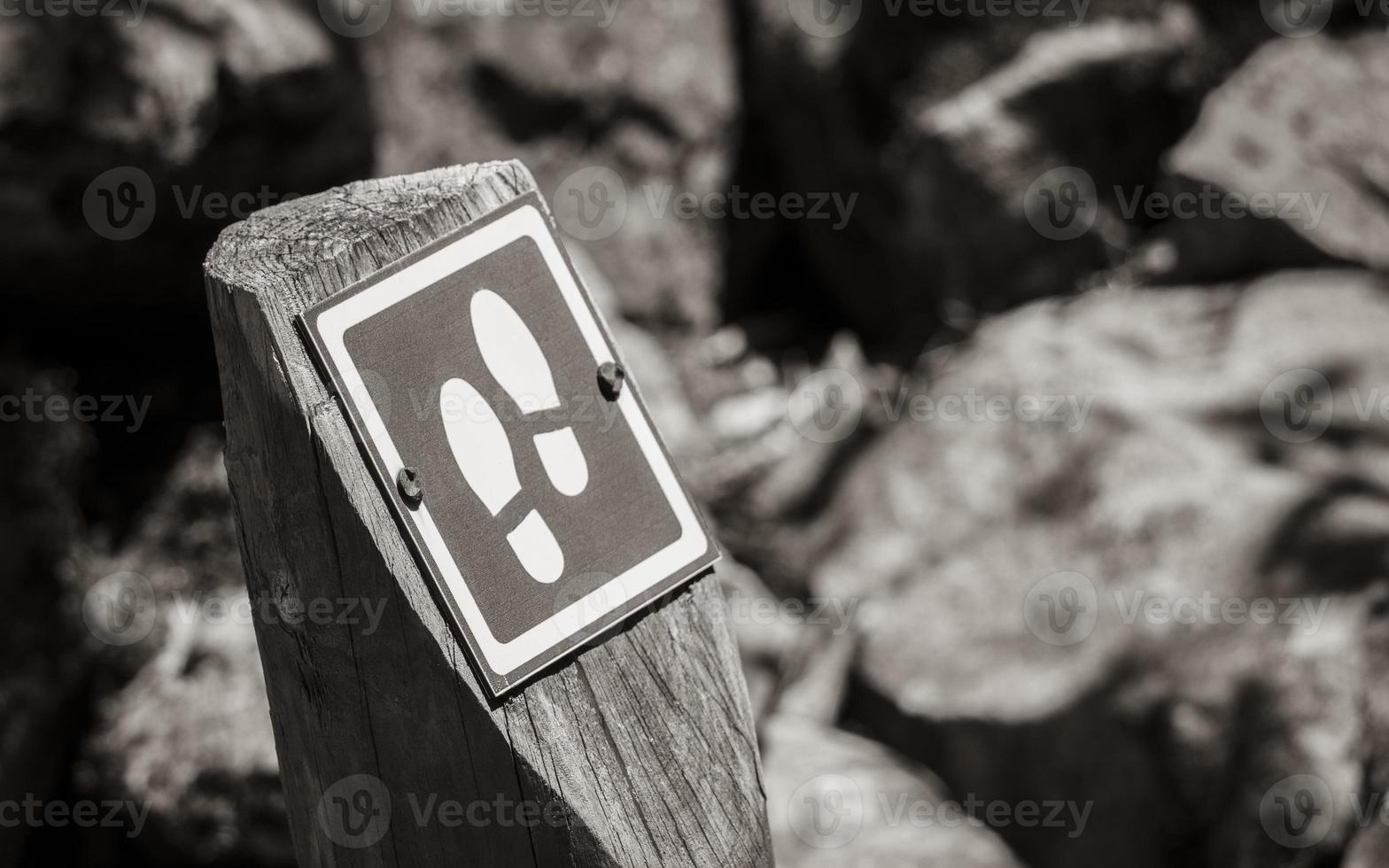 Hiking route Cape Town to Table Mountain. Signpost with footprints. photo