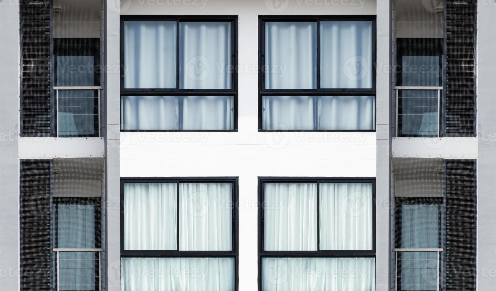 Pattern glass window on modern white building photo