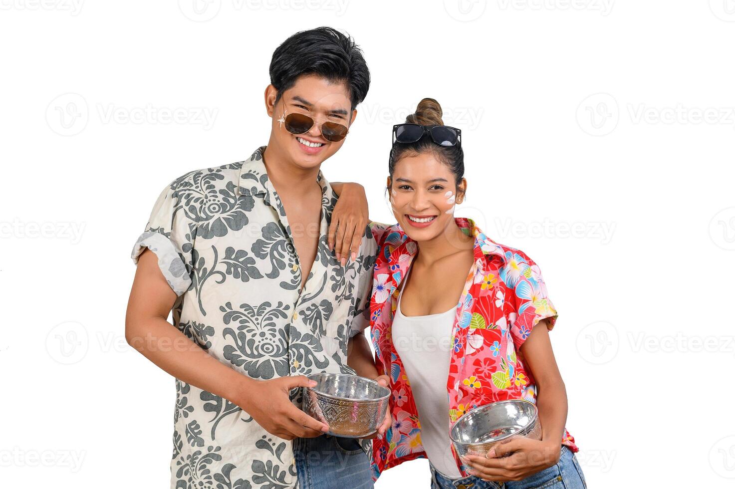 Portrait Young couple enjoy with water bowl on Songkran festival photo