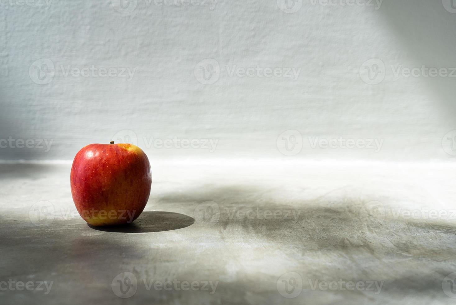 Red Apple Placing on Floor photo