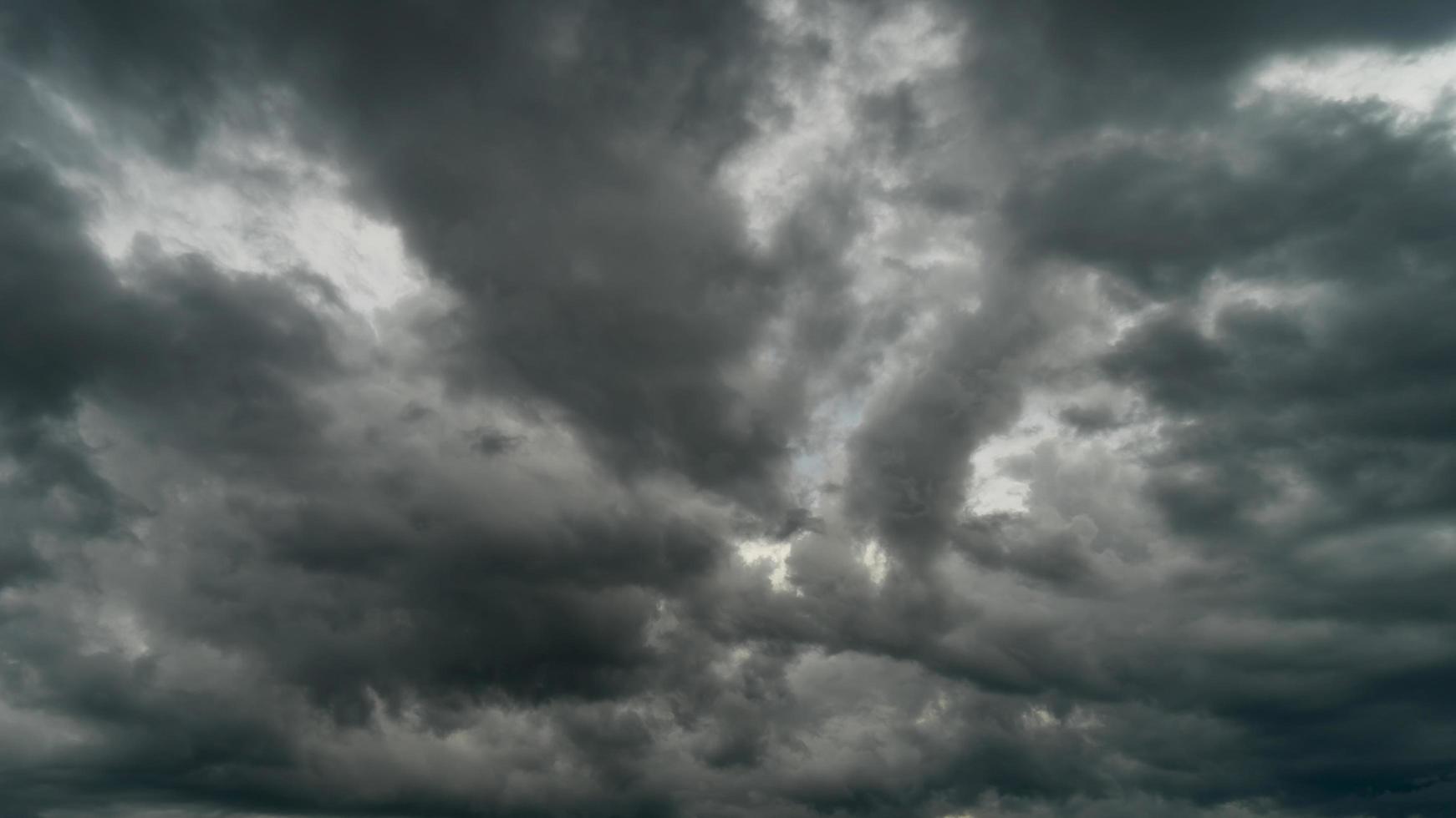 Dramatic storm clouds at dark sky in rainy season photo