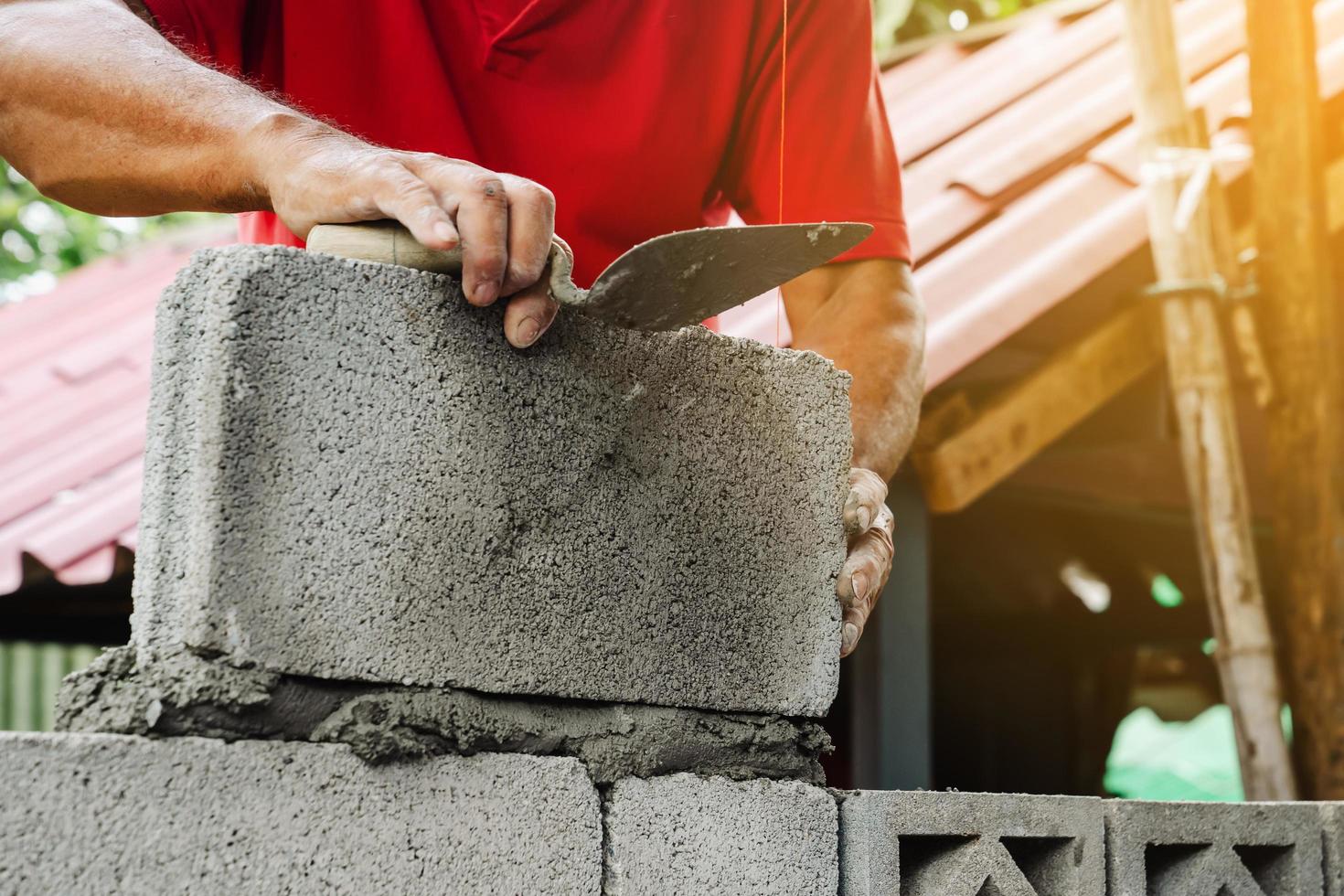 bricklayer man working build for construction at home photo