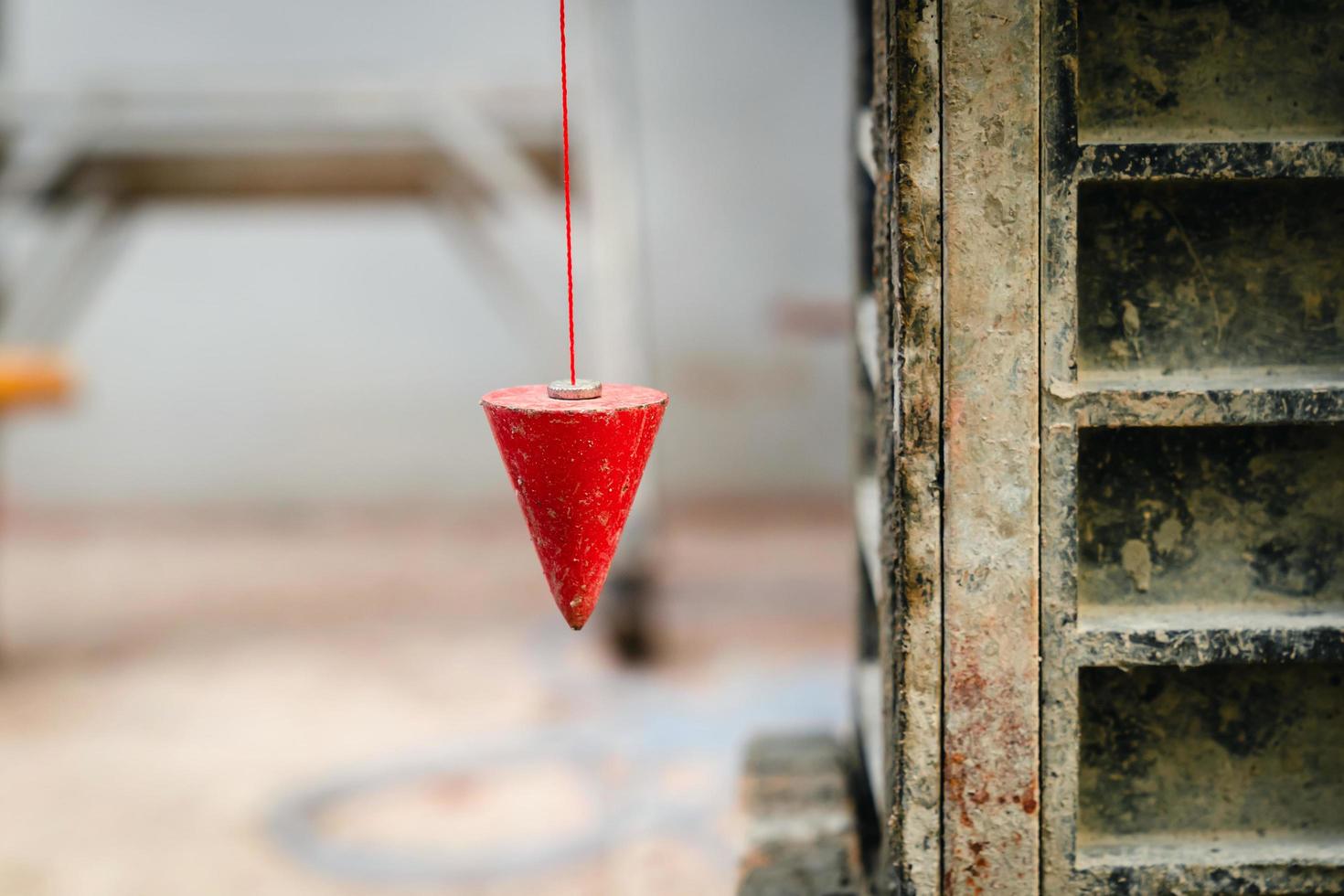 pendulum with plum for finding vertical line photo