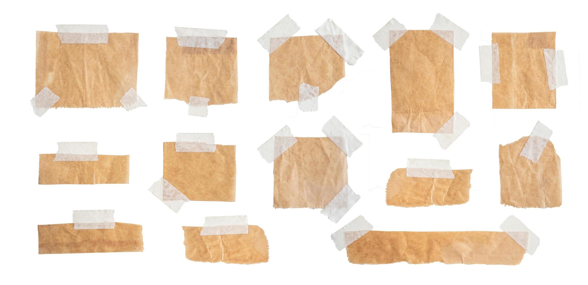 Brown paper labels attached set with sticky tape on isolate white background photo