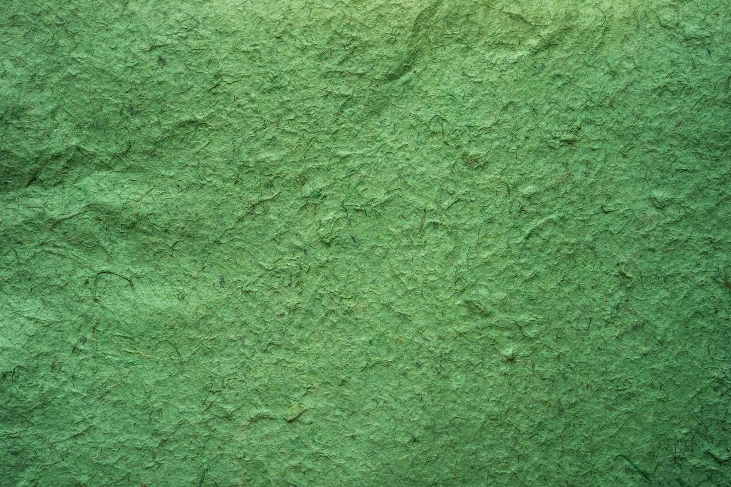Close up crumpled craft paper green texture and background with copy space photo