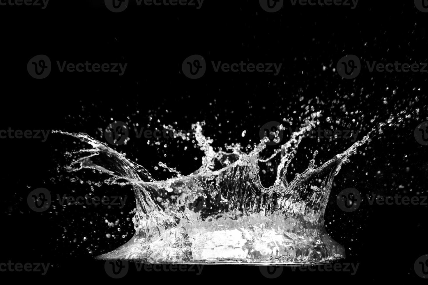 Splashing water on a black background. water splash refreshing black background photo
