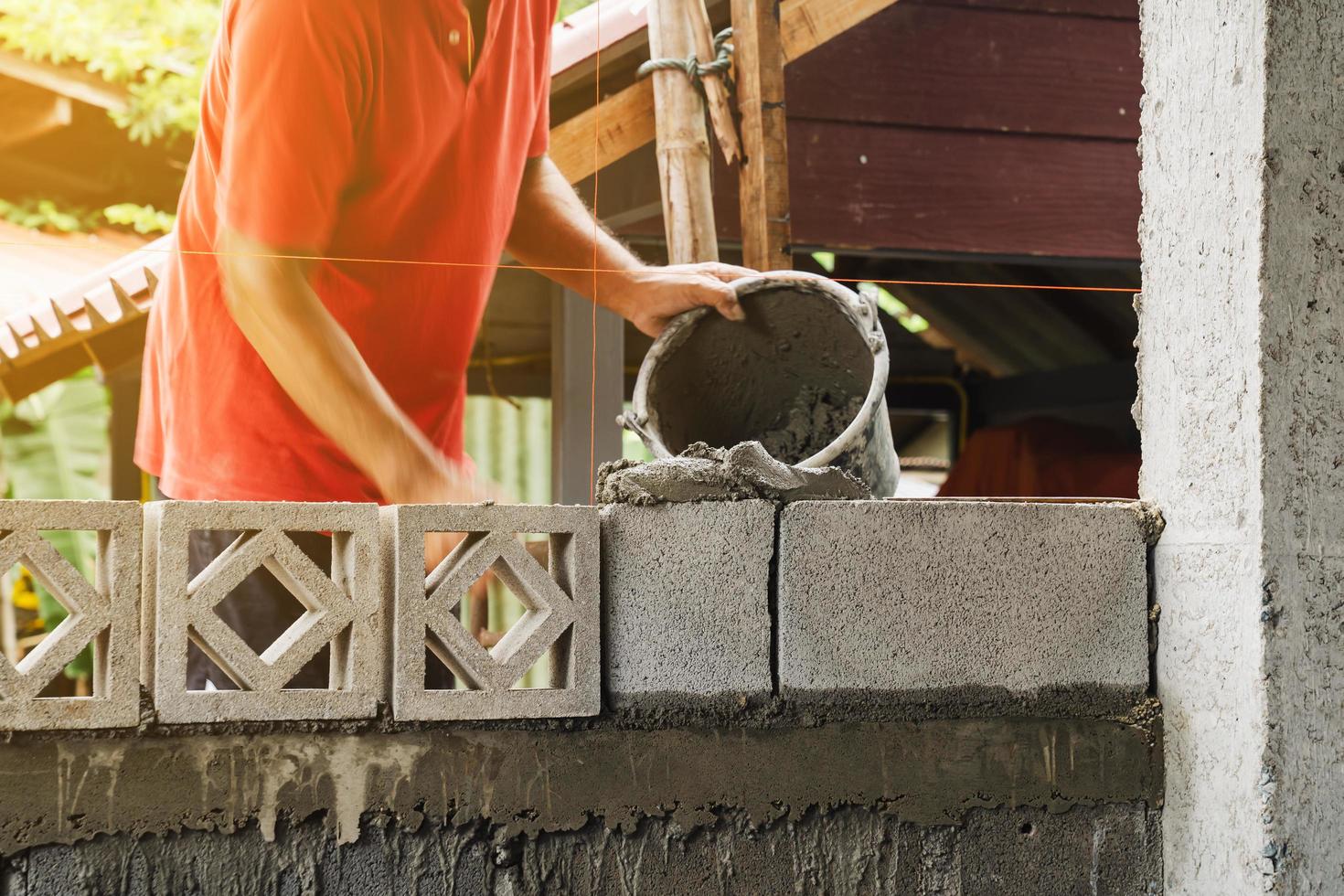 Motion blur bricklayer man working build for construction at home photo