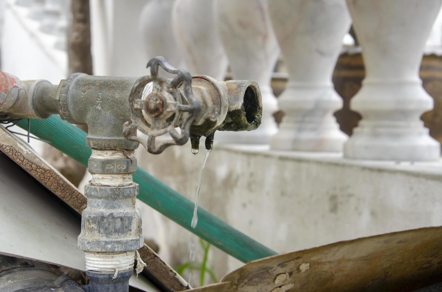 Old faucets or tap water are damaged causing water leaks and wasting water.. photo