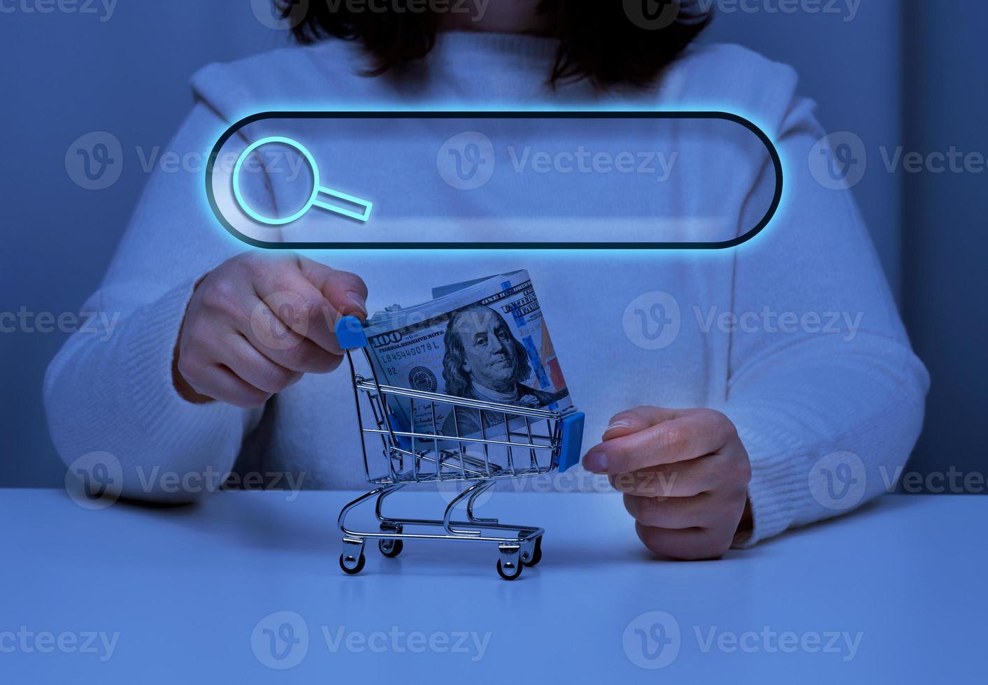 woman holds a metal tedeku with paper american dollars and a line for entering information search, online shopping, inquiry photo