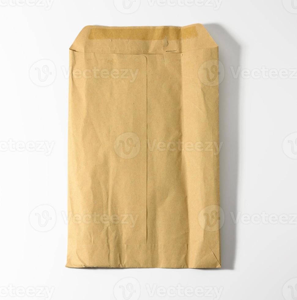 rectangular open brown kraft paper envelope on white background photo