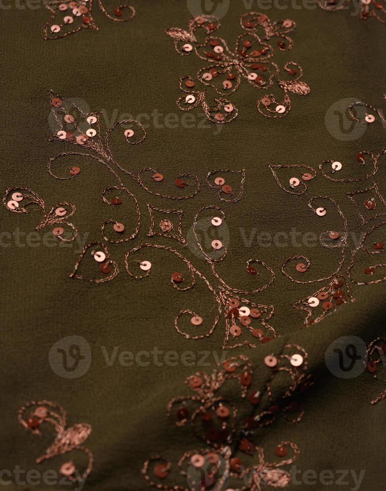 dark green fabric with sequin embroidery, fabric for tailoring photo