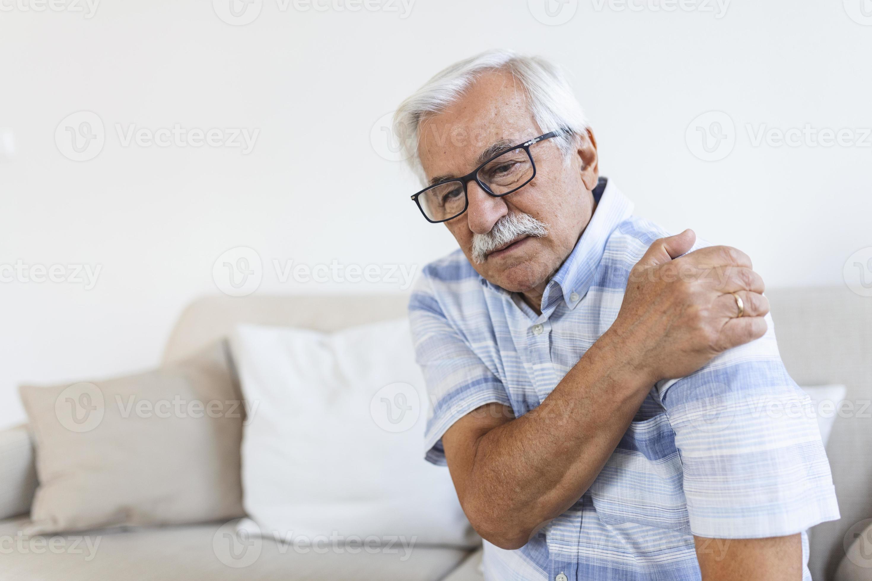 Old senior man with shoulder pain. Upset senior elder man feel sudden back pain muscles ache
