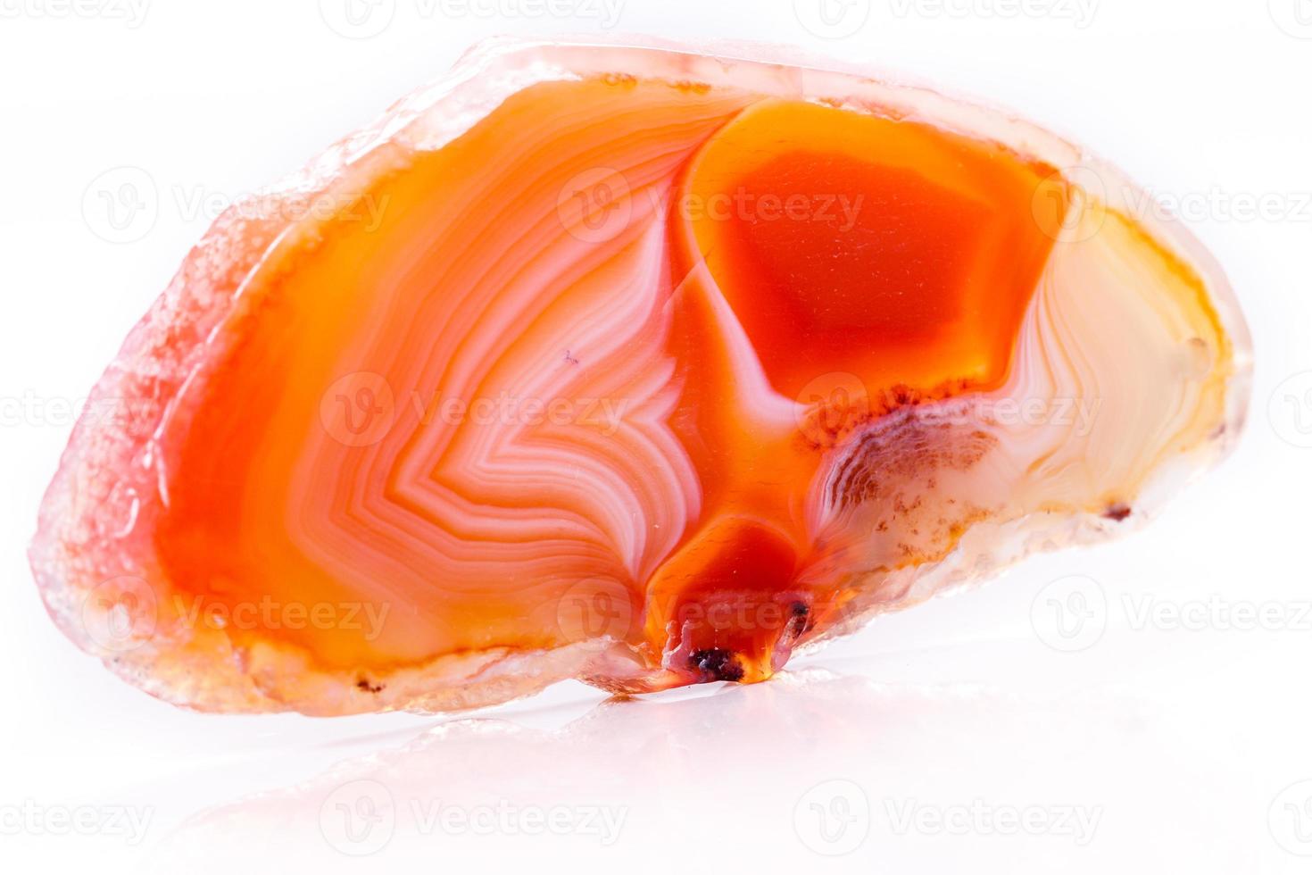 Macro mineral orange agate in crystals on white background photo