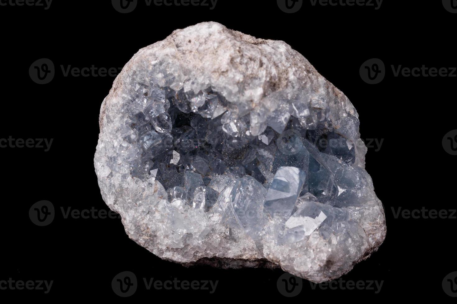 Celestine mineral stone macro on microcline on black background photo