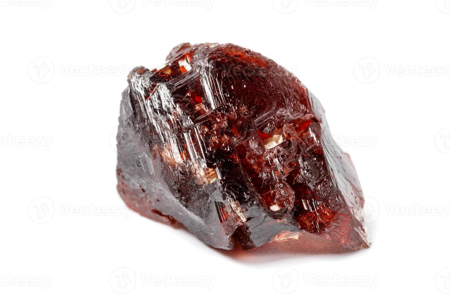 Macro mineral stone Garnet Spessartine on a white background photo