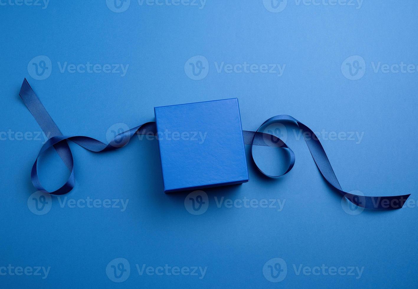 closed cardboard gift square box, ribbons for packaging photo