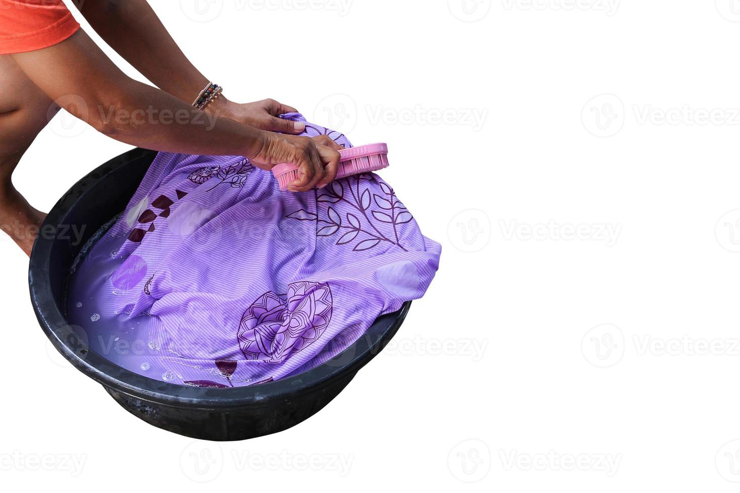 Woman wash hand dirty clothing in the basin black  isolated on white background and clipping path photo