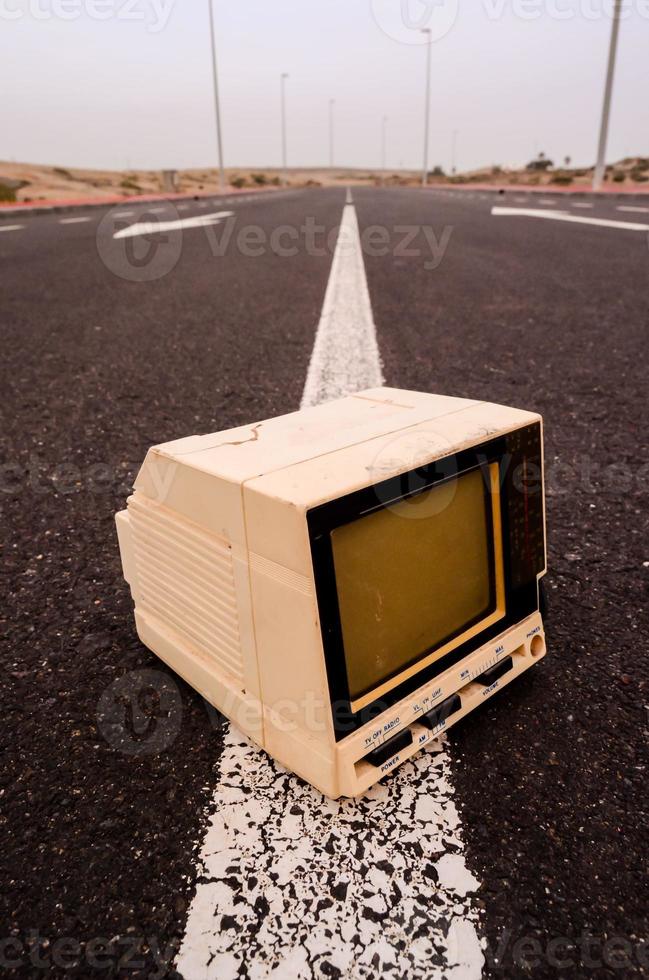 Old television on the road photo