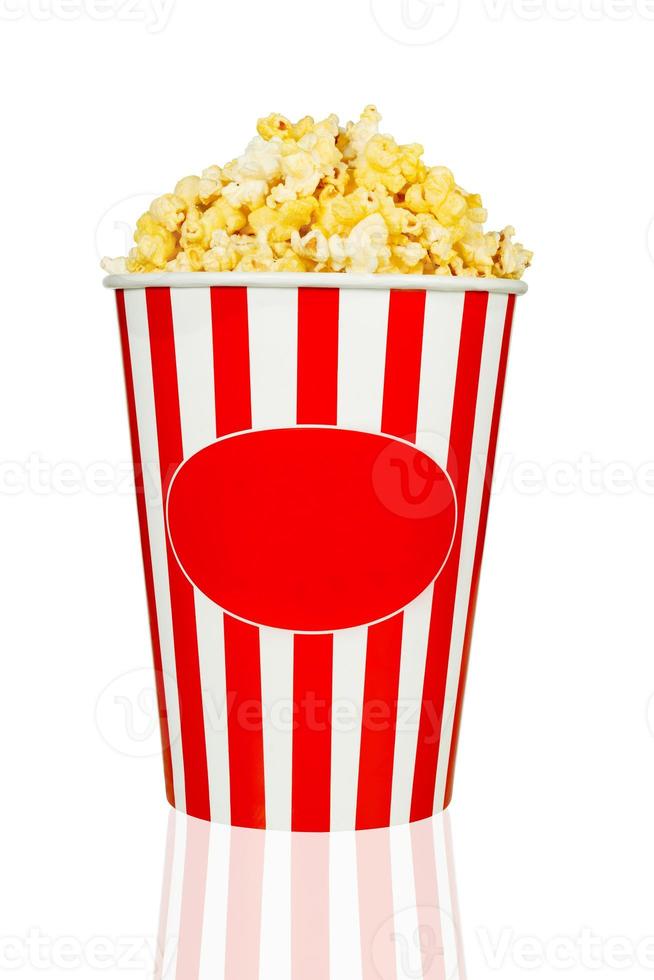 Cheese popcorn in red and white striped bucket isolated on white background with clipping path photo