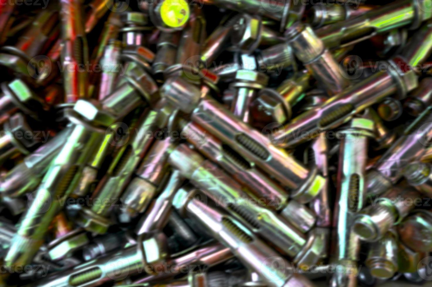 Anchor bolts. Building background for design. A set of bolts, nuts, metal fasteners. Assortment collection of steel screws close-up. photo