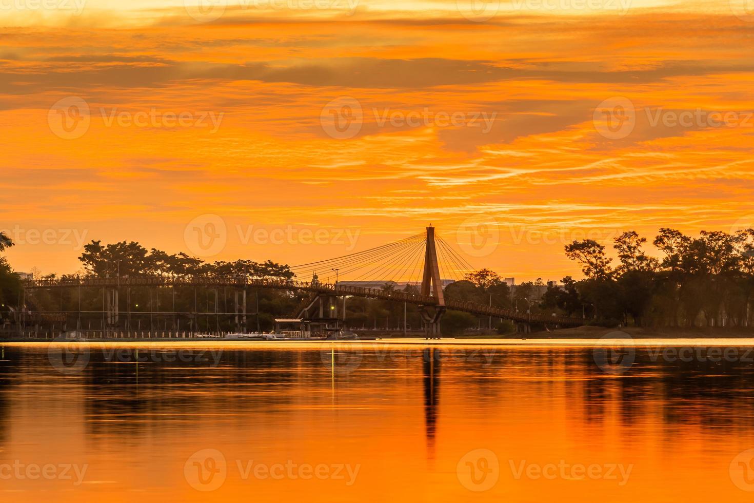 sunset nearly fall from the sky on the horizon reflected into the water photo