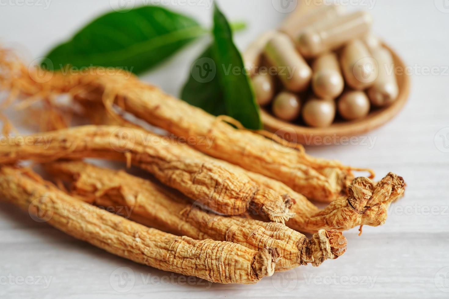 Ginseng roots and green leaf, healthy food. photo