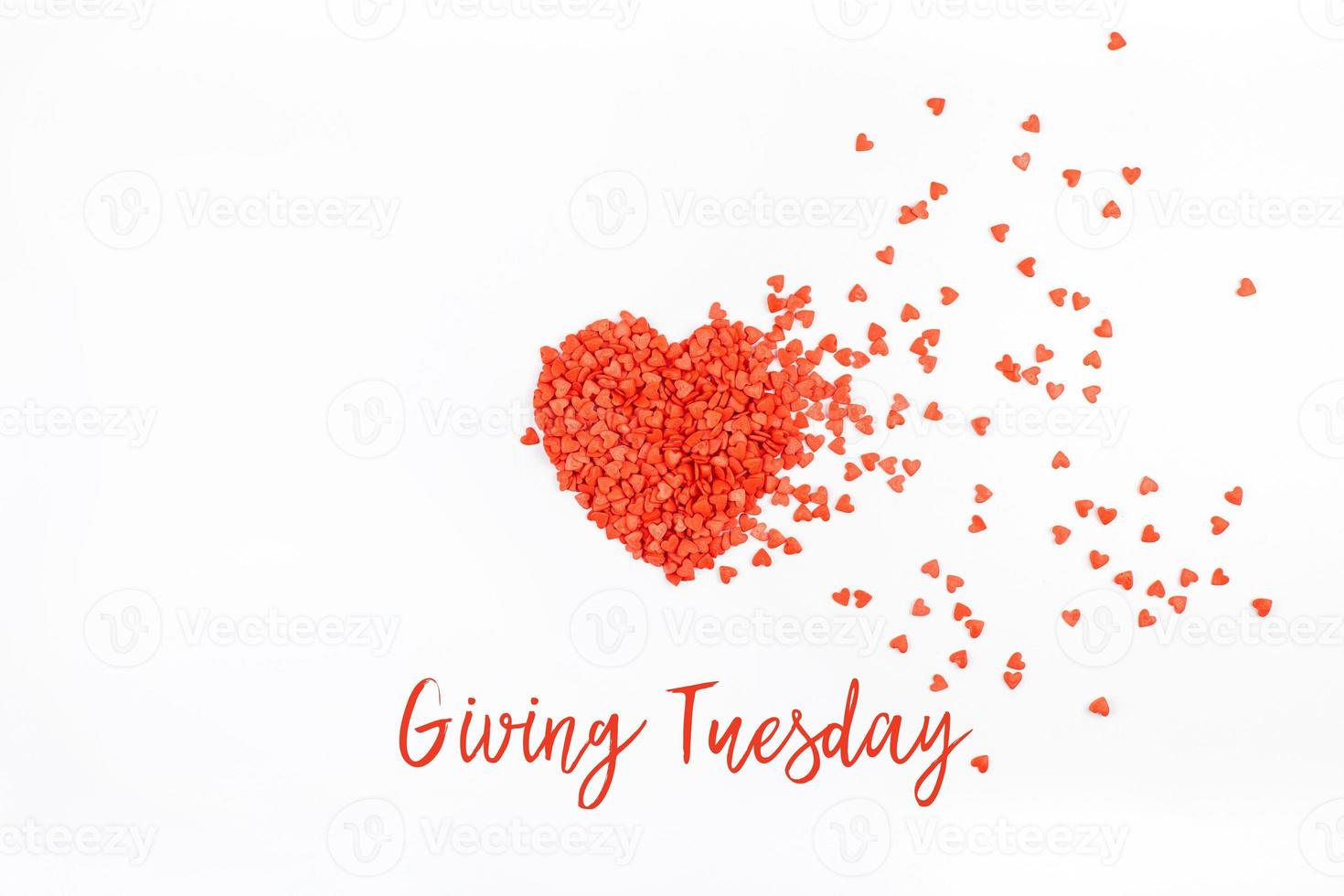 Giving Tuesday concept with red heart on white photo