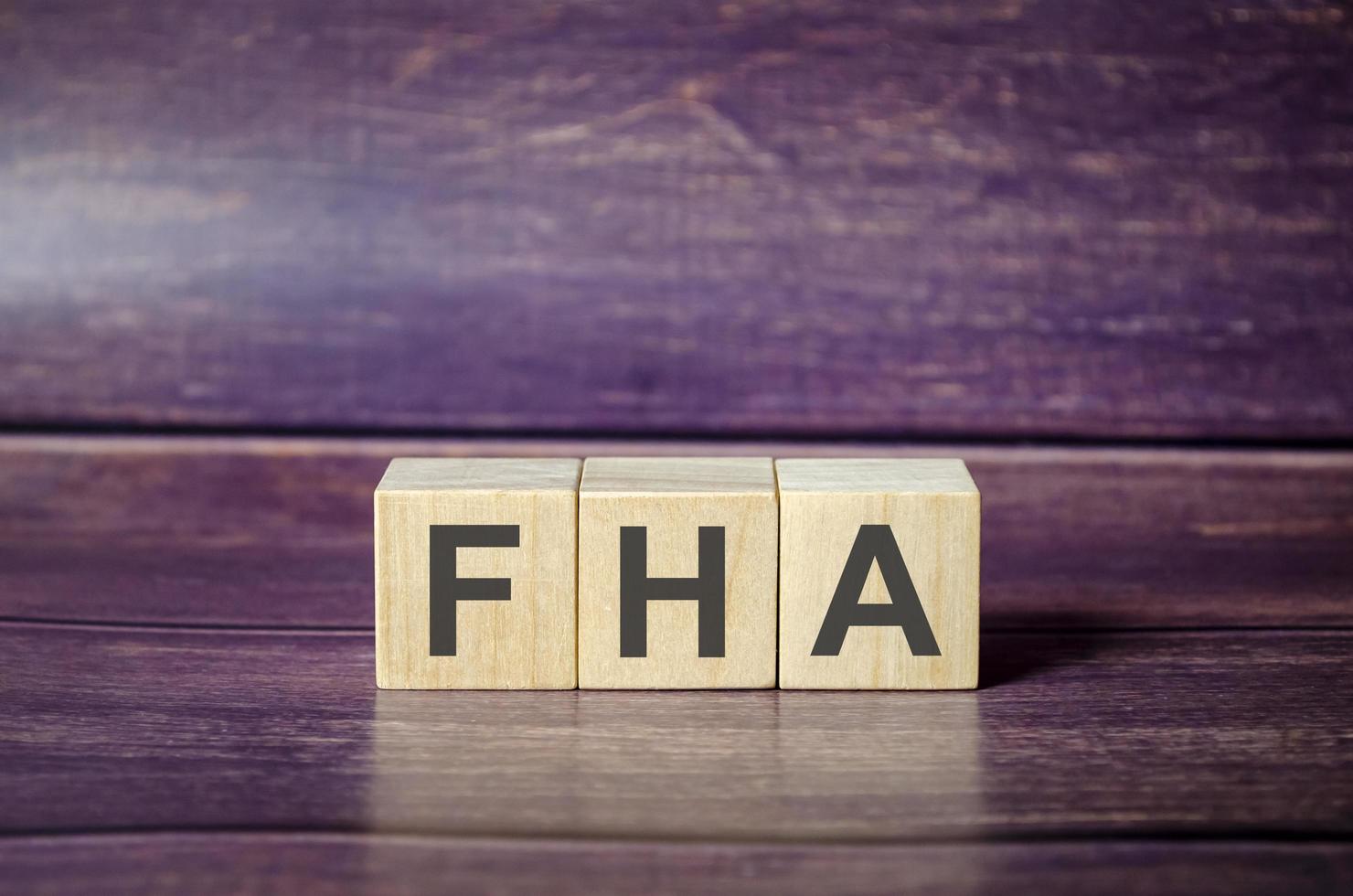 Wooden cubes form the word FHA, federal housing administration photo