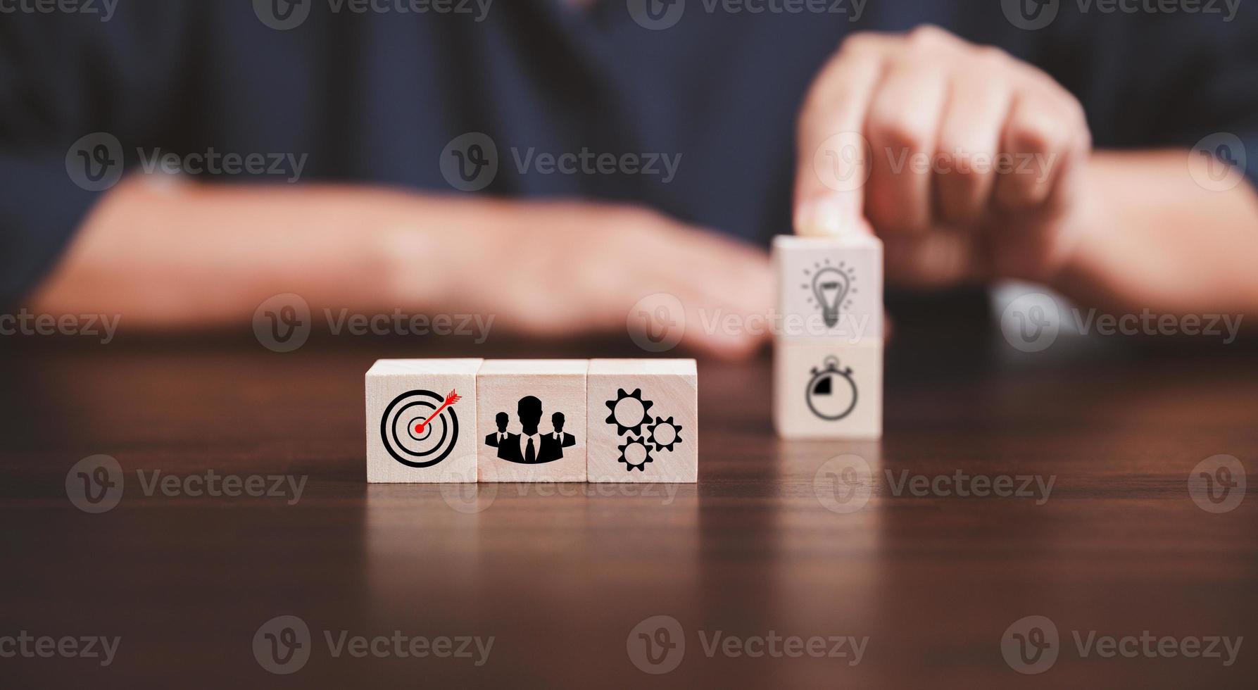 Target or goal with strategy plan, success business revenue concept. Symbols of arrows, diagrams businesses are present on wood cube. objective management, achievement startup, growth marketing idea. photo