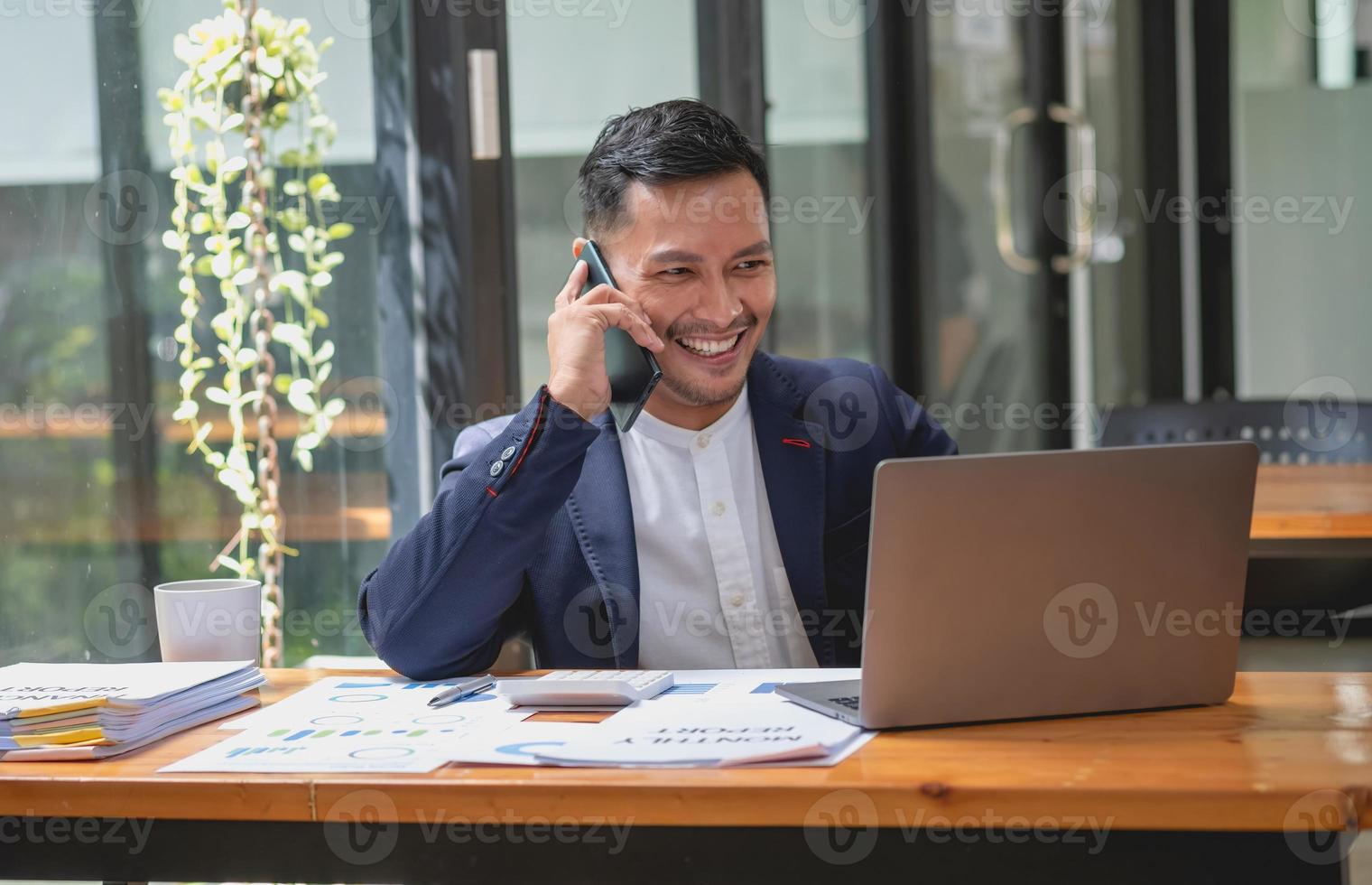 Marketing, Financial, Accounting, Planning, businessman uses a mobile phone to contact a customer to inform her of the company is business partnership. photo