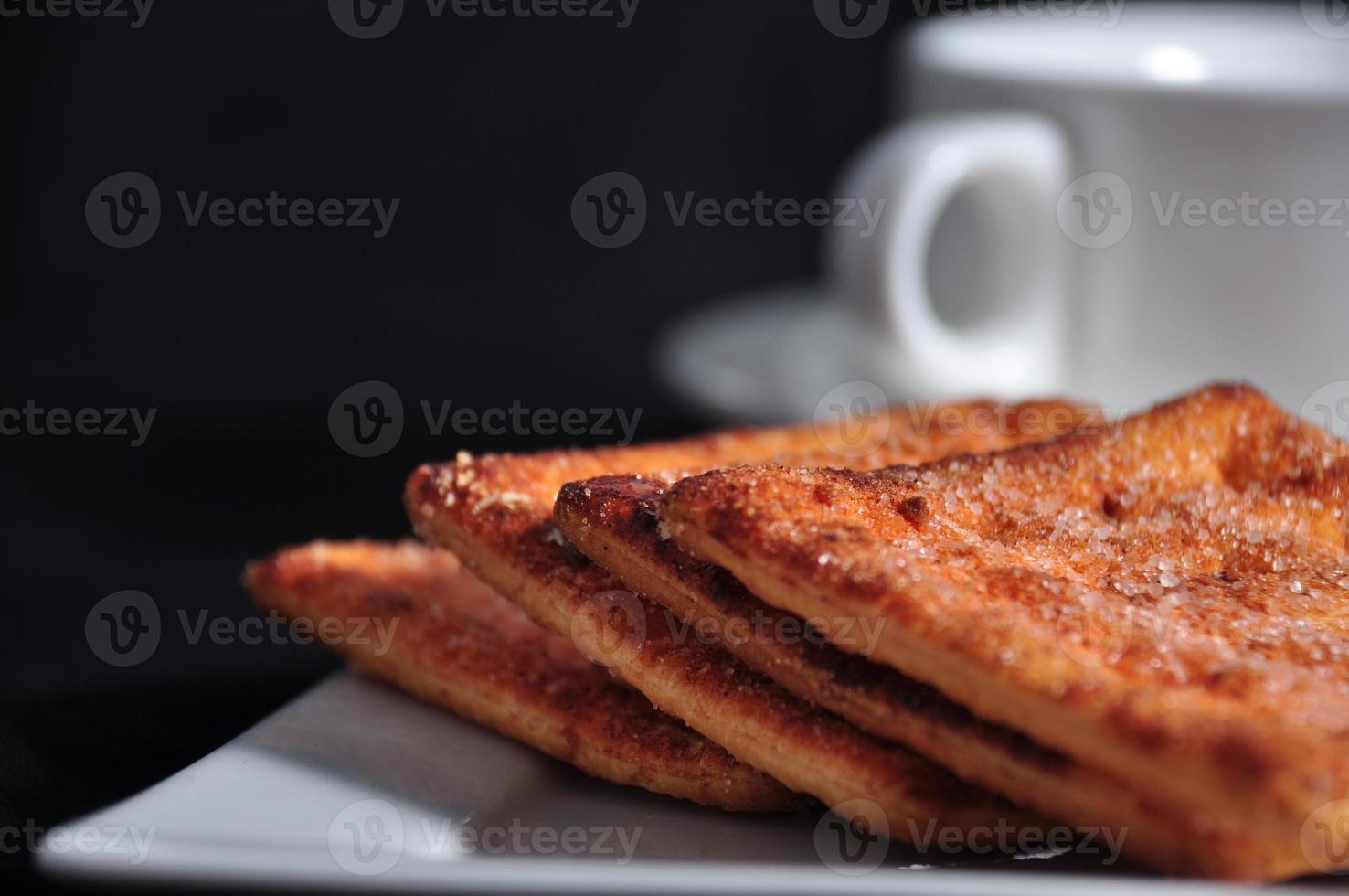 stack of cracker on the white plate photo