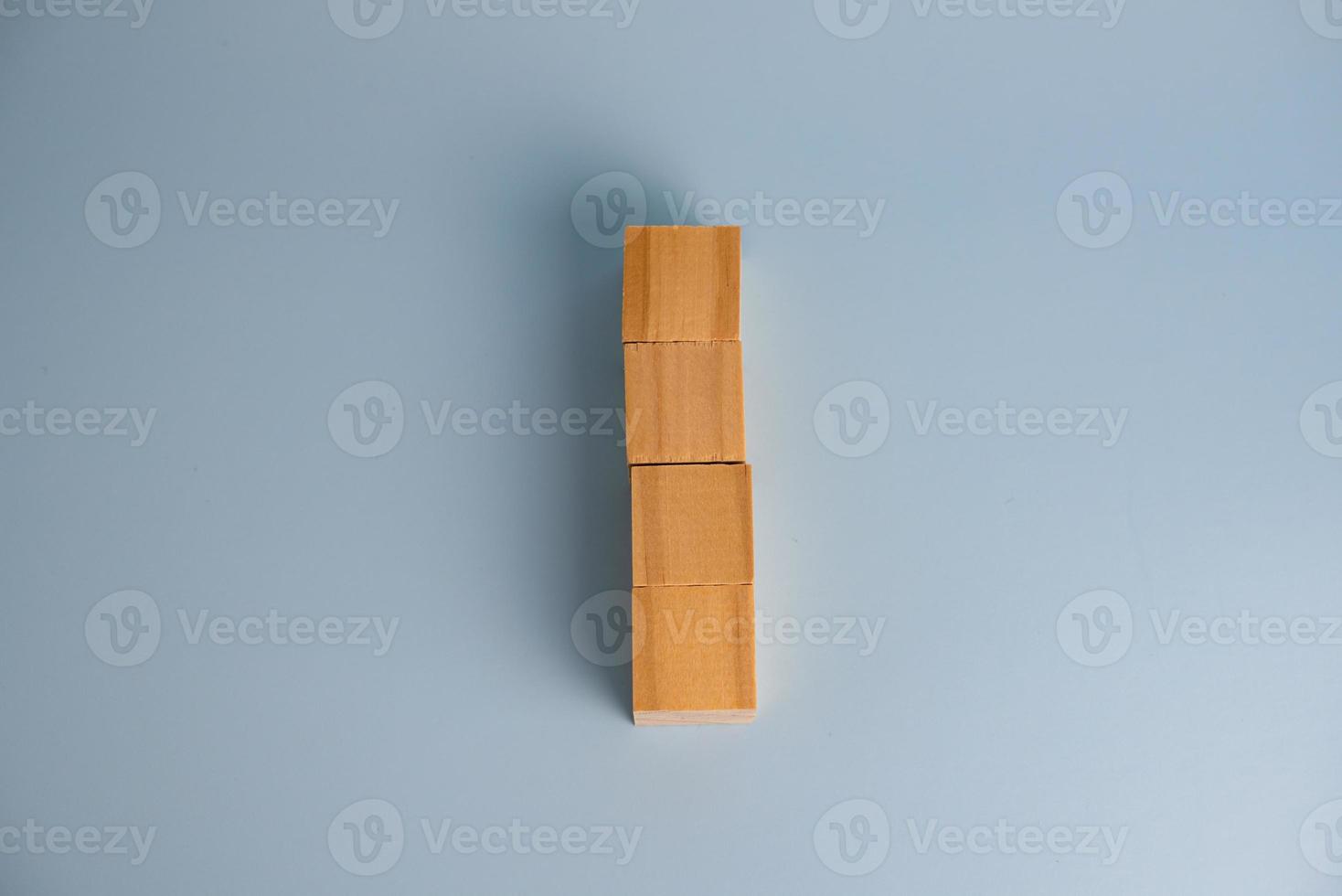 Four blank wooden block cubes on background for your text. Business concept template and banner. photo