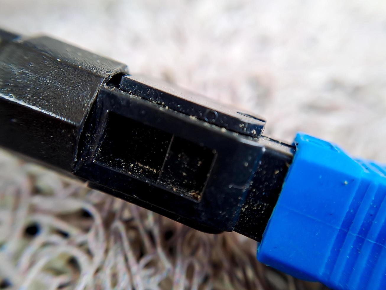 A used blue wifi cable that is no longer used because it's broken photo