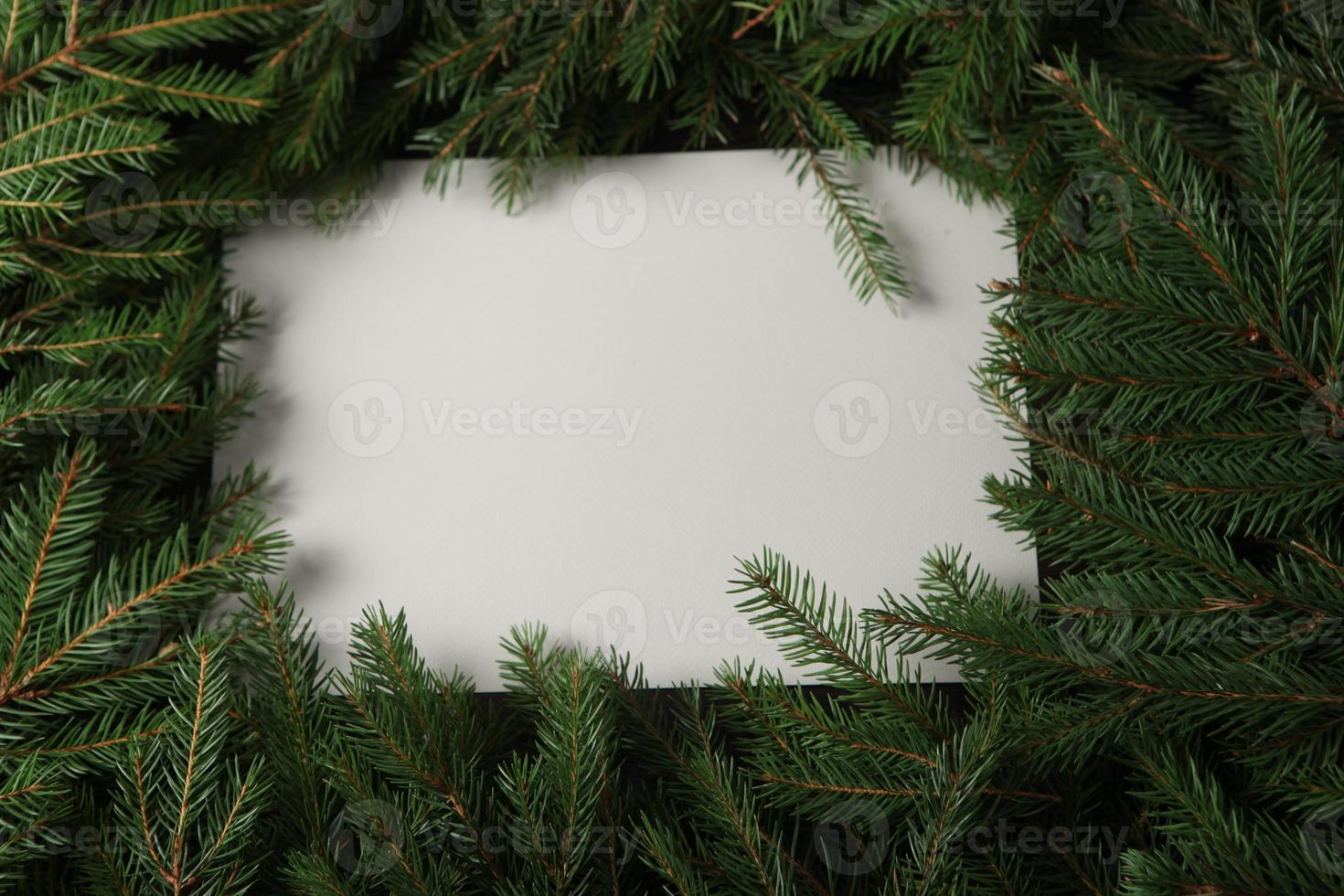 New Year's Eve background with fir branch and cones. Christmas and New Year holidays composition of pine tree branches. photo