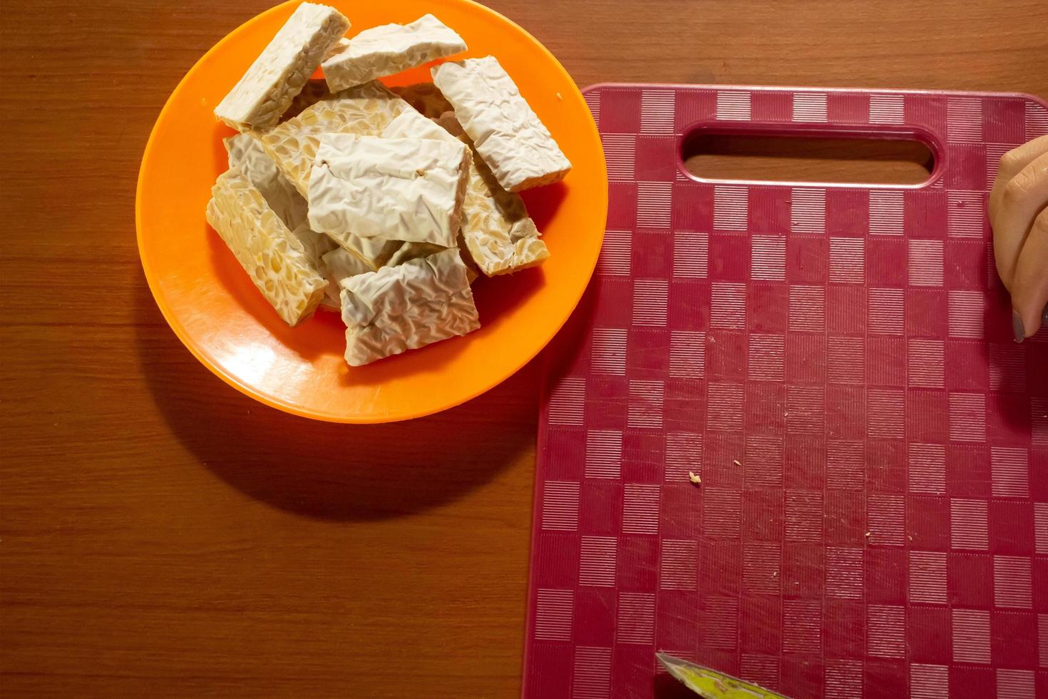tempeh in a plastic container that is placed on the table photo
