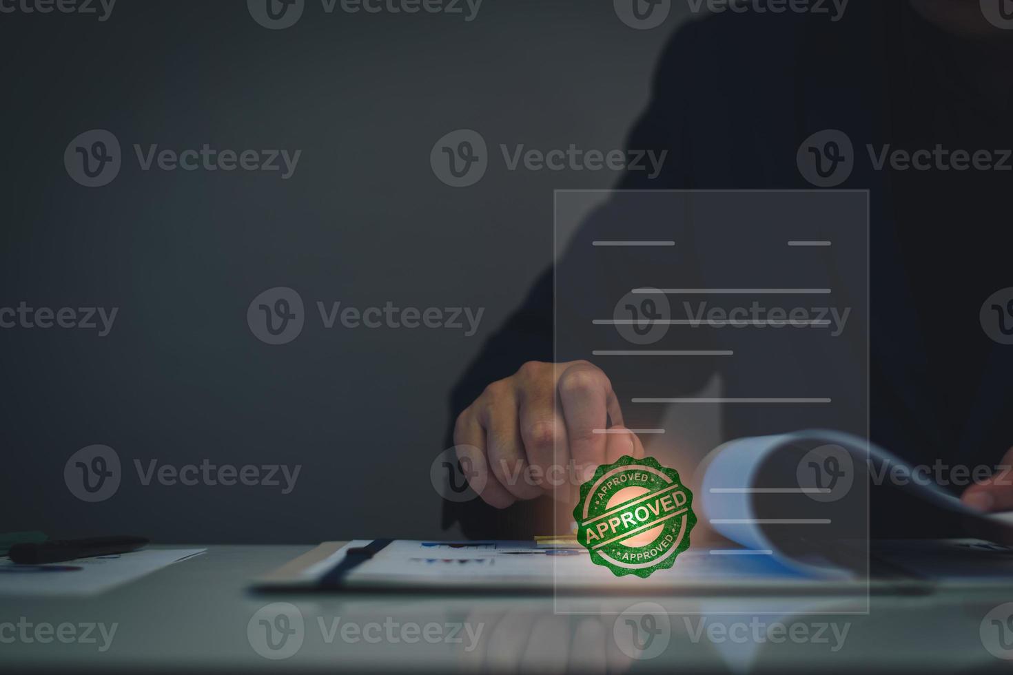 Business approved concept. Manager hand stamping with approved stamp on certificate document public paper, investment certificate, business document, certificate approved, investment allowed. photo