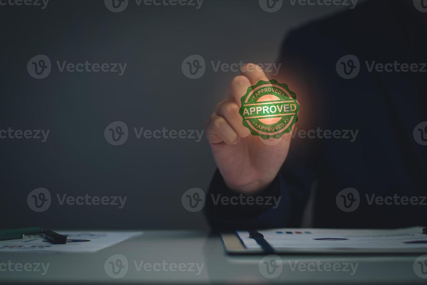 Business approved concept. Manager hand stamping with approved stamp on certificate document public paper, investment certificate, business document, certificate approved, investment allowed. photo