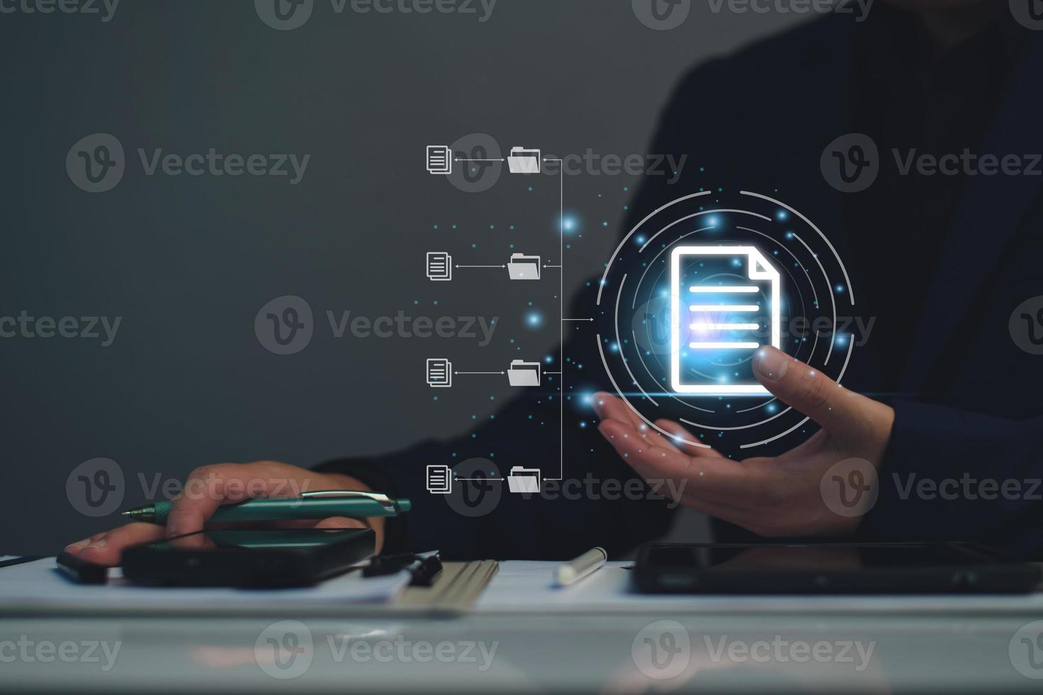 Document management system concept, business man holding folder and document icon software, searching and managing files online document database, for efficient archiving and company data. photo