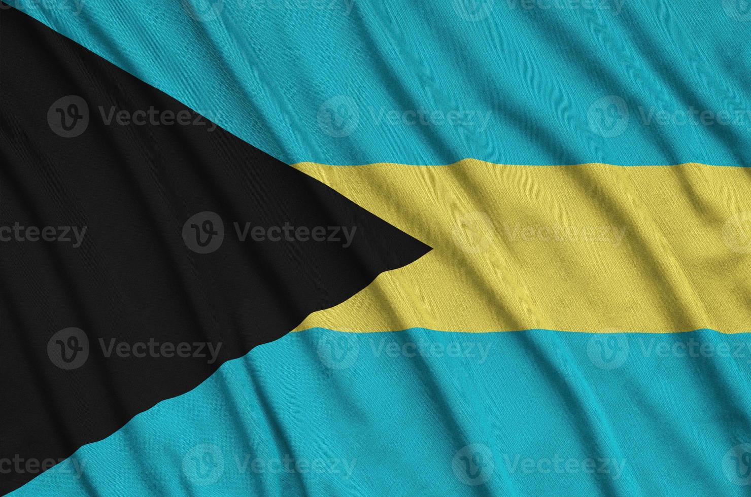 Bahamas flag is depicted on a sports cloth fabric with many folds. Sport team banner photo