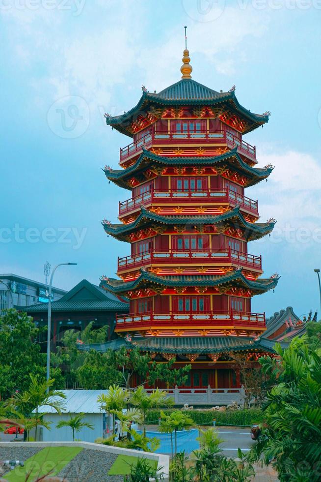 A Pagoda in the center of a Chinatown with the statue of Guan Yin. photo