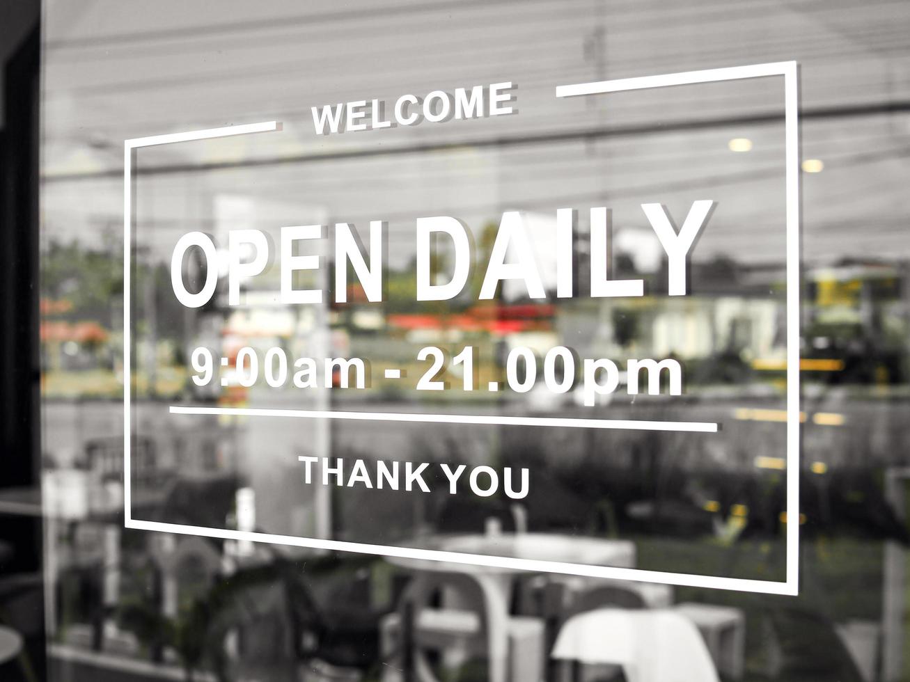 sign informing customers of cafes on holidays. Open sign on the glass door of the restaurant. service business idea open everyday photo