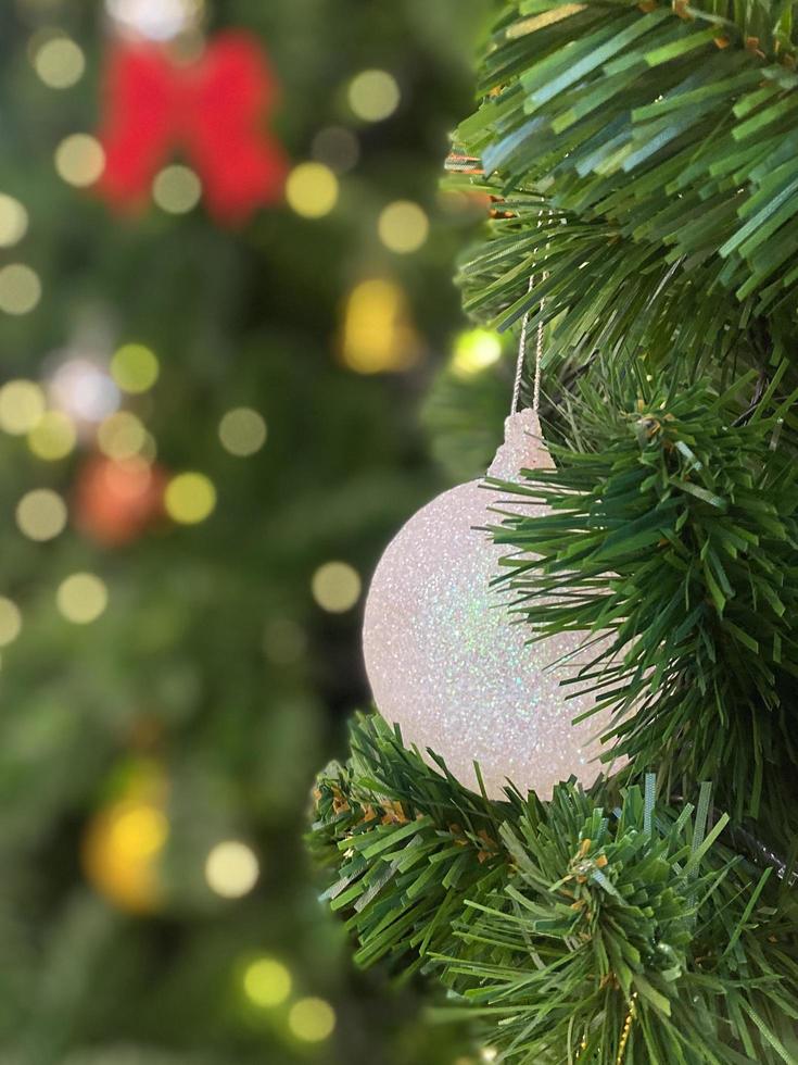 Christmas ball on tree background. Happy New year and Merry Christmas 2023 celebration concept photo