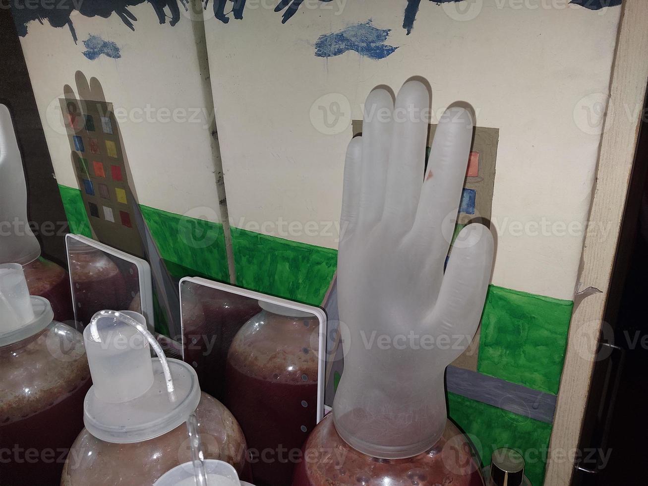 Fermenting homemade wine in cans closed with a water seal photo