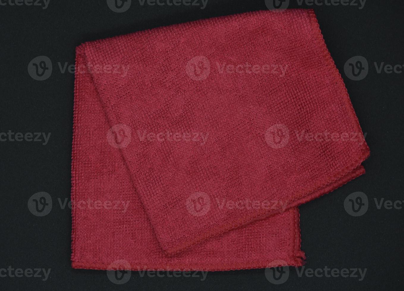 A red cloth for wiping. A terry towel. A rag for cleaning the premises. photo