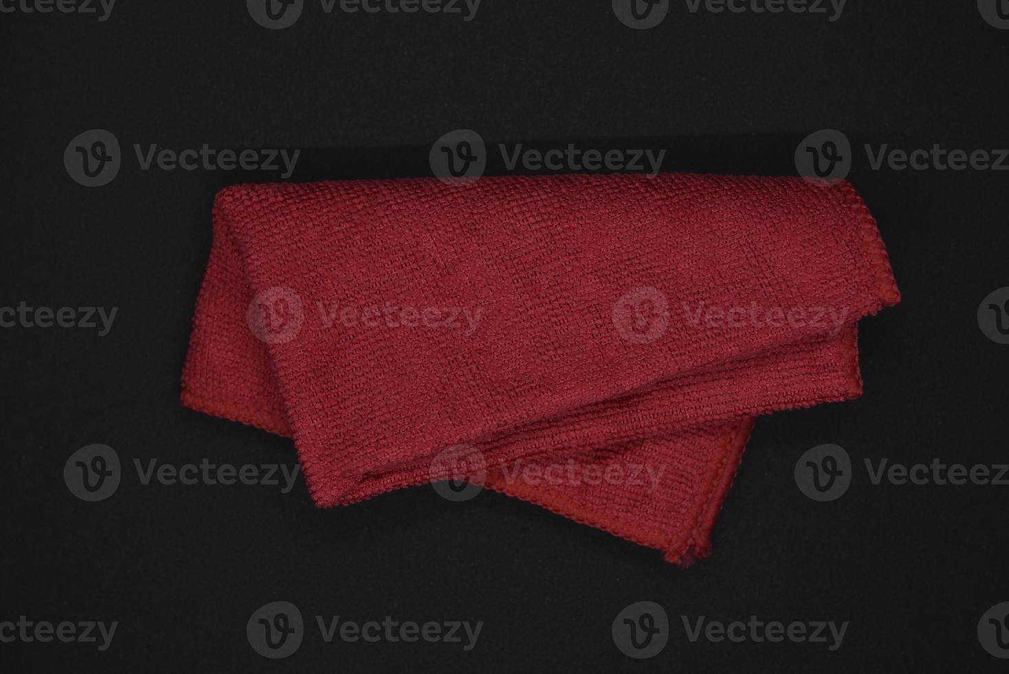 A red cloth for wiping. A terry towel. A rag for cleaning the premises. photo