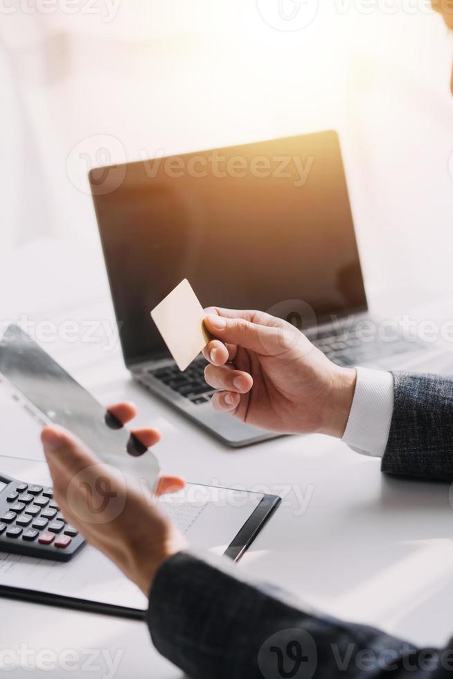 Close up of woman hand using credit card and laptop for payment and online shopping, Online shopping, payments digital banking, E-commerce concept. photo