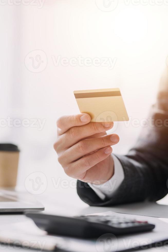 Close up of woman hand using credit card and laptop for payment and online shopping, Online shopping, payments digital banking, E-commerce concept. photo