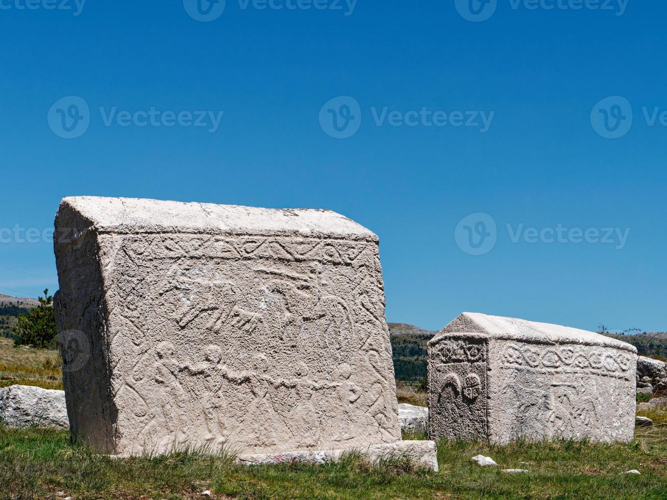 Stecci Medieval Tombstones Graveyards Dugo Polje in Blidinje, BiH. Unesco site. Historic place of interest. The tombstones feature a wide range of decorative motifs and inscriptions. photo