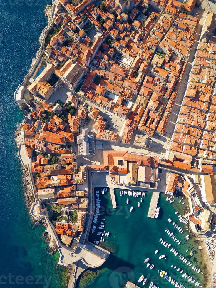 Aerial drone view of the Old historic city of Dubrovnik in Croatia, UNESCO World Heritage site. Famous tourist attraction in the Adriatic Sea. Fortified old city. Tourism and travel to Croatia. photo