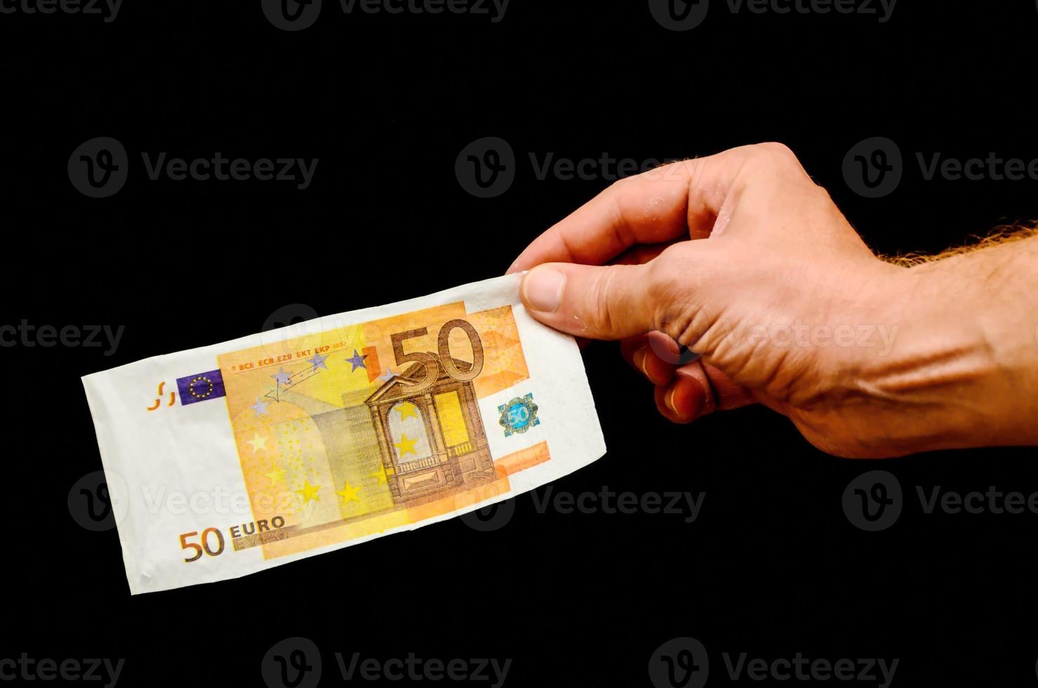 Hand holding cash bill photo